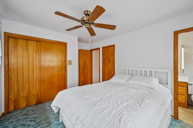 bedroom featuring a closet, a ceiling fan, carpet flooring, and ensuite bath