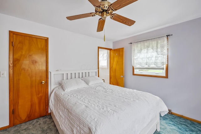 bedroom with carpet flooring, baseboards, and a ceiling fan