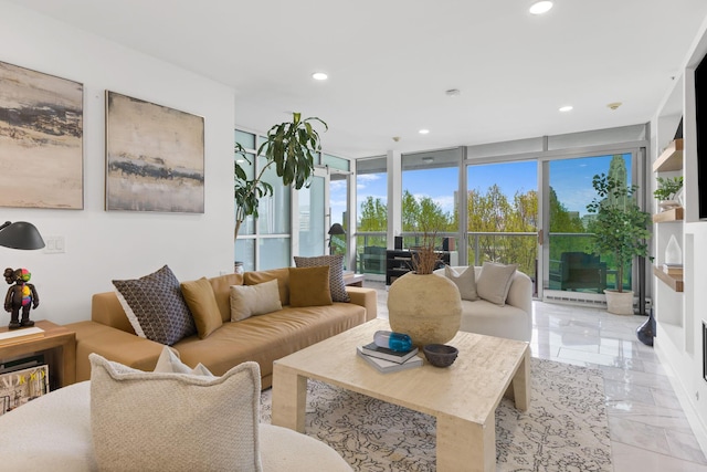 living area featuring recessed lighting, marble finish floor, and floor to ceiling windows