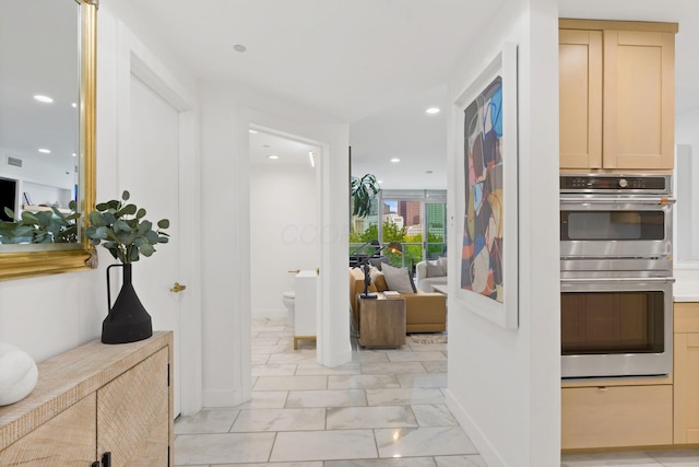hall with baseboards, recessed lighting, and marble finish floor