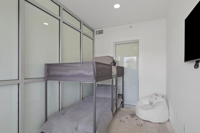 bedroom featuring visible vents