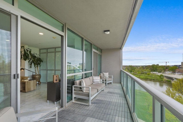 balcony featuring a water view