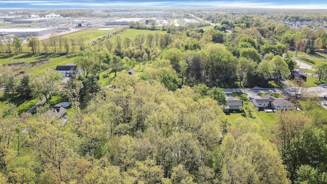 drone / aerial view featuring a view of trees