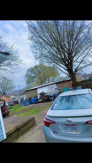 view of car parking featuring fence