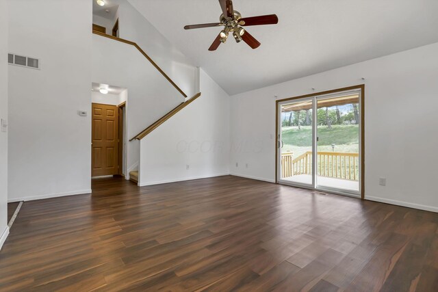 unfurnished living room with dark wood-style floors, ceiling fan, high vaulted ceiling, stairs, and visible vents