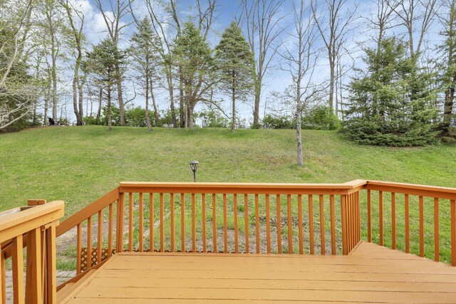 wooden terrace with a yard
