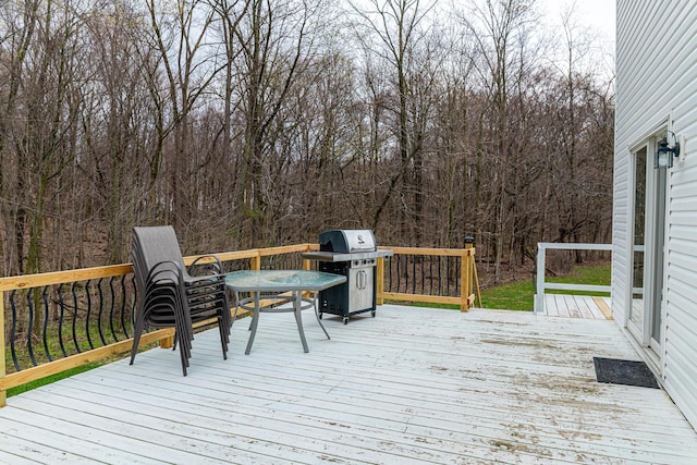 wooden deck featuring grilling area