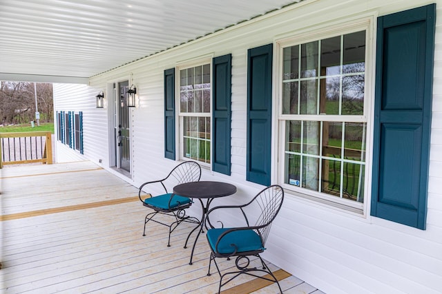 wooden deck featuring covered porch