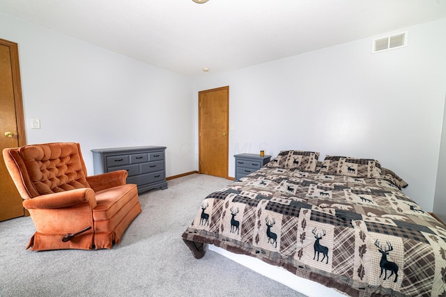 bedroom featuring visible vents and light colored carpet