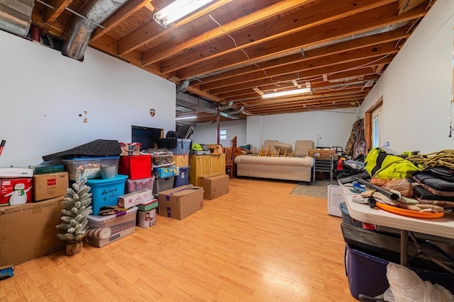 basement with light wood-style flooring