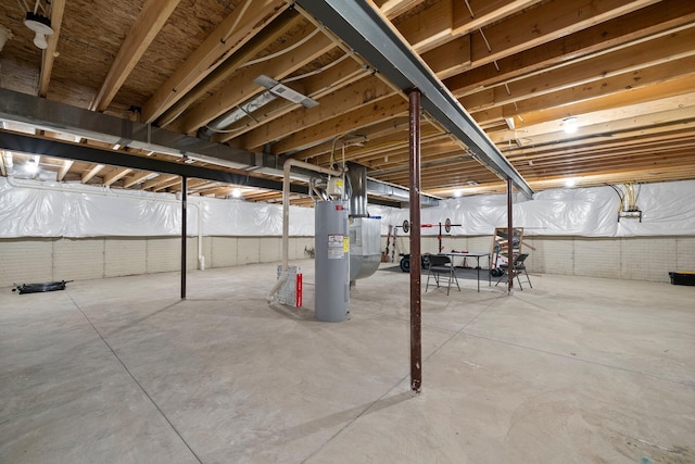 unfinished basement featuring electric water heater