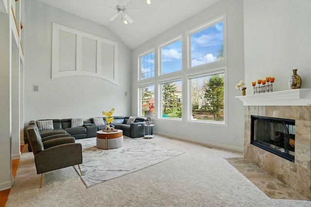 4201 Penrith Ct, Dublin, OH 43016 - carpeted living room featuring high vaulted ceiling, baseboards, a ceiling fan, and a tile fireplace