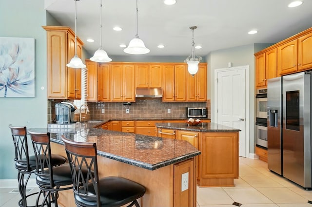 4201 Penrith Ct, Dublin, OH 43016 - kitchen with light tile patterned floors, a peninsula, stainless steel appliances, and a sink