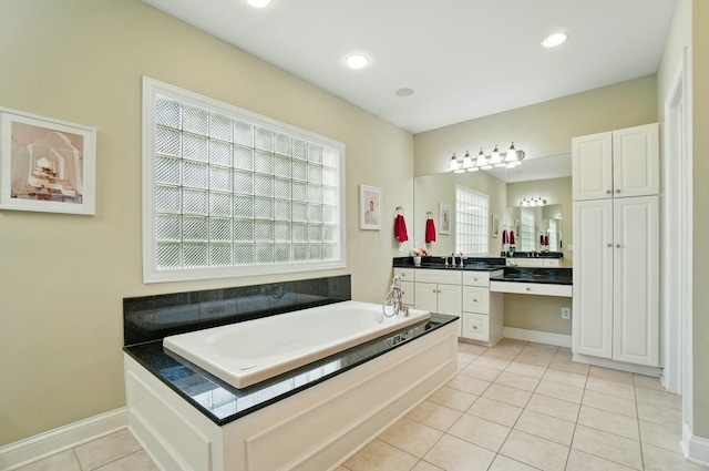 4201 Penrith Ct, Dublin, OH 43016 - bathroom featuring tile patterned floors, a bath, vanity, baseboards, and recessed lighting