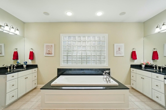 4201 Penrith Ct, Dublin, OH 43016 - bathroom featuring a garden tub, tile patterned flooring, and a sink