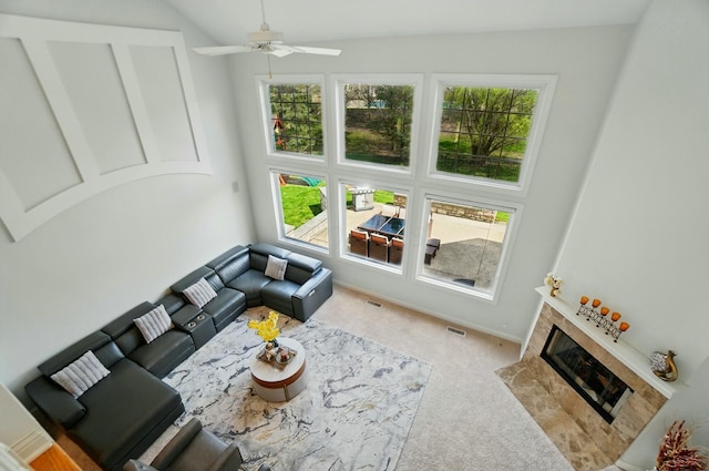 4201 Penrith Ct, Dublin, OH 43016 - living room featuring a high end fireplace, visible vents, a ceiling fan, carpet flooring, and high vaulted ceiling