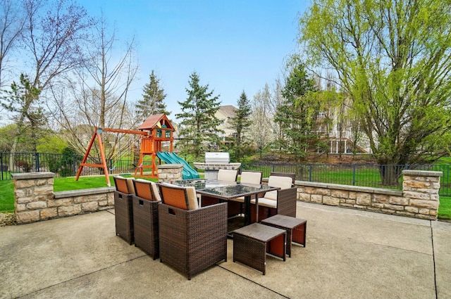 4201 Penrith Ct, Dublin, OH 43016 - view of patio / terrace with outdoor dining area, a playground, and a fenced backyard