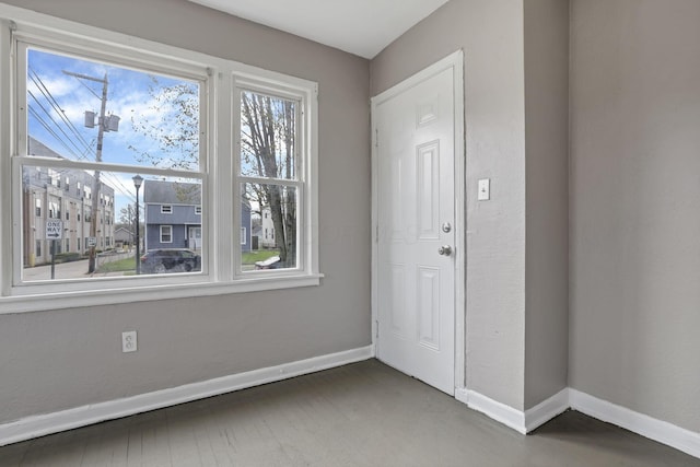 foyer featuring baseboards
