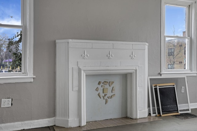 room details featuring baseboards and wood finished floors