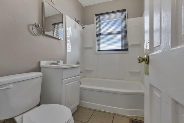 full bath featuring tile patterned flooring, bathtub / shower combination, toilet, and vanity