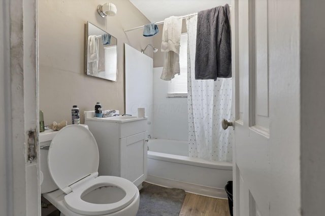 full bathroom with vanity, toilet, wood finished floors, and shower / tub combo with curtain