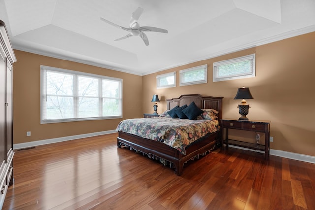6700 Ballantrae Pl, Dublin, OH 43016 - bedroom with ceiling fan, ornamental molding, visible vents, wood finished floors, and a raised ceiling