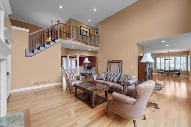 6700 Ballantrae Pl, Dublin, OH 43016 - living area featuring baseboards, visible vents, light wood-style floors, and crown molding