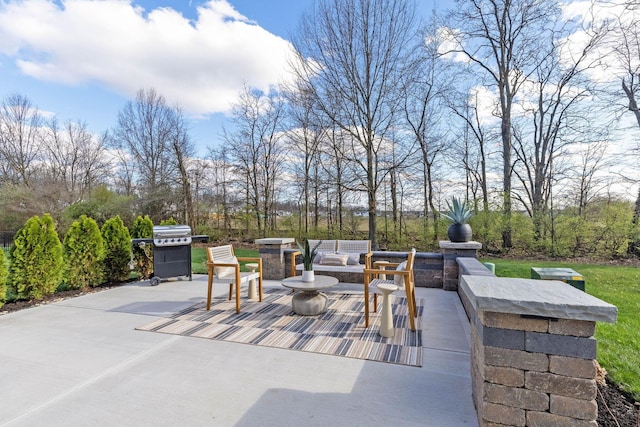 view of patio featuring outdoor lounge area and a grill