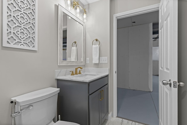 half bathroom featuring toilet and vanity