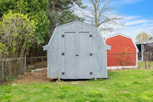 view of shed with fence