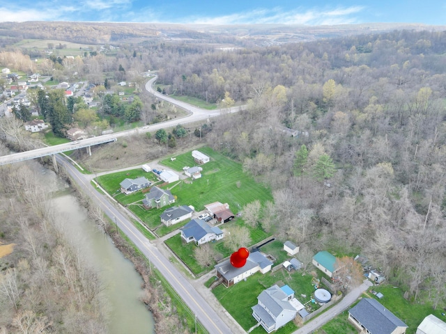 bird's eye view featuring a residential view and a view of trees