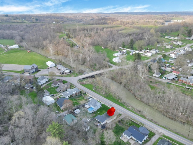 birds eye view of property with a wooded view and a residential view