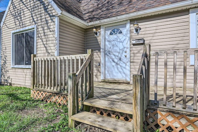 595 Collingwood Ave, Columbus, OH 43213 - view of exterior entry with a wooden deck and a shingled roof
