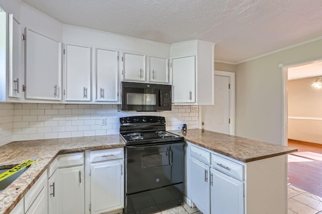 595 Collingwood Ave, Columbus, OH 43213 - kitchen with a peninsula, white cabinets, ornamental molding, and black appliances