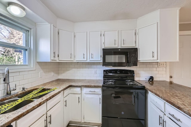 595 Collingwood Ave, Columbus, OH 43213 - kitchen with white cabinets, decorative backsplash, a sink, and black appliances