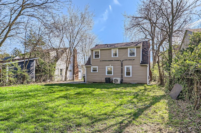 595 Collingwood Ave, Columbus, OH 43213 - rear view of house featuring fence, a yard, and cooling unit