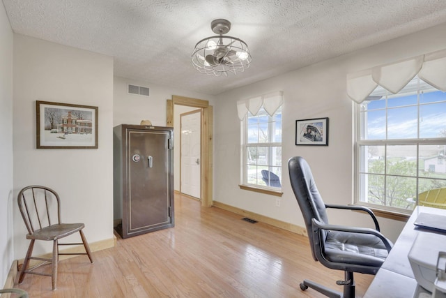 1649 Loudon St, Granville, OH 43023 - office area with light wood finished floors, visible vents, a textured ceiling, and a notable chandelier