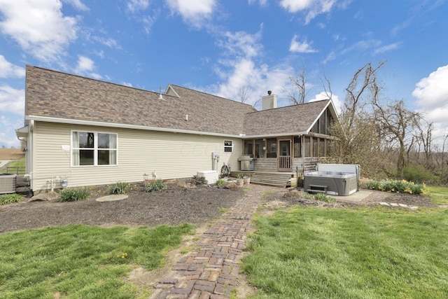 1649 Loudon St, Granville, OH 43023 - back of house with a chimney, a lawn, a hot tub, a sunroom, and roof with shingles