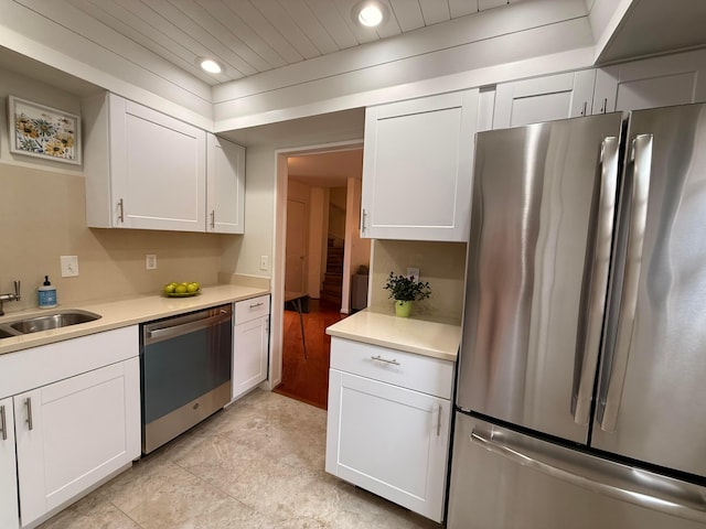 1610 Lafayette Dr Unit 1610, Columbus, OH 43220 - kitchen with appliances with stainless steel finishes, a sink, light countertops, recessed lighting, and white cabinets