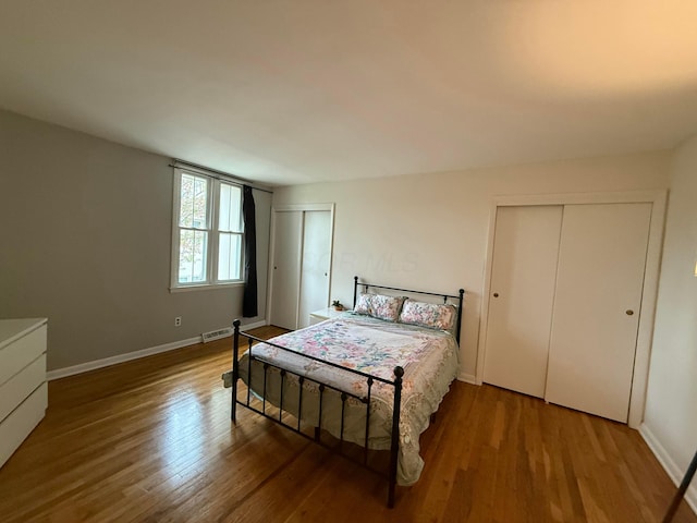 1610 Lafayette Dr Unit 1610, Columbus, OH 43220 - bedroom with multiple closets, wood finished floors, and baseboards