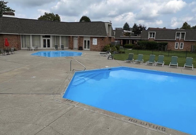 1610 Lafayette Dr Unit 1610, Columbus, OH 43220 - community pool with french doors and a patio