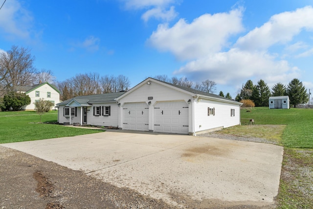 view of front of home with a garage, driveway, and a front lawn