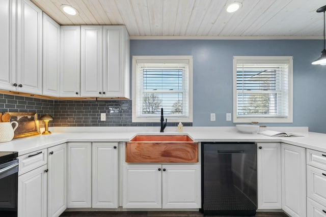 kitchen with a sink, tasteful backsplash, recessed lighting, white cabinetry, and black dishwasher
