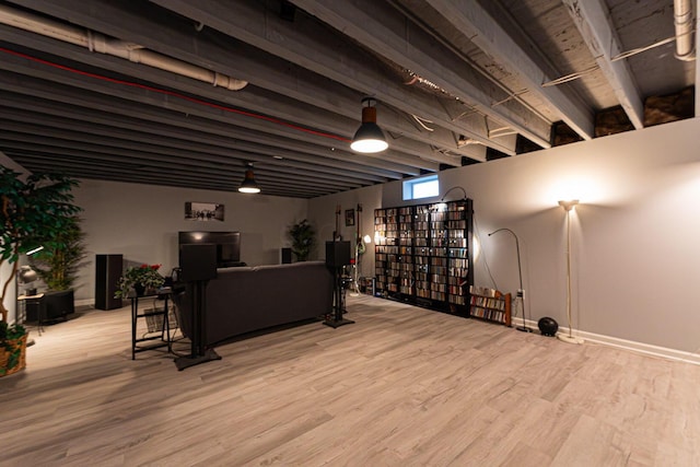interior space featuring baseboards and wood finished floors