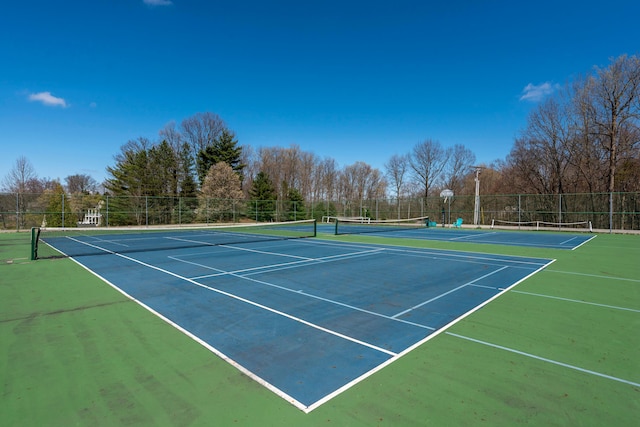 view of sport court featuring fence and community basketball court