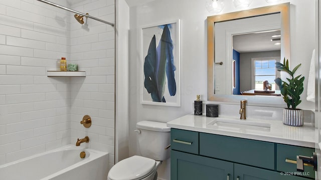 bathroom with toilet, vanity, and  shower combination