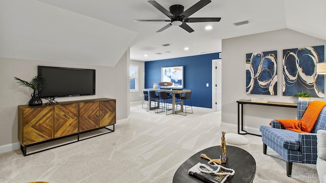 living area with visible vents, baseboards, a ceiling fan, and carpet flooring