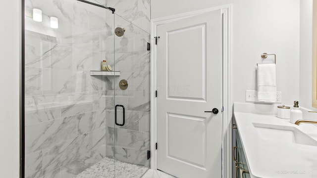 bathroom featuring vanity and a shower stall
