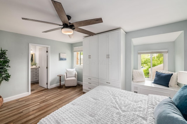 3588 Reed Rd Unit 4, Columbus, OH 43221 - bedroom with multiple windows, light wood-style flooring, a ceiling fan, and ensuite bath