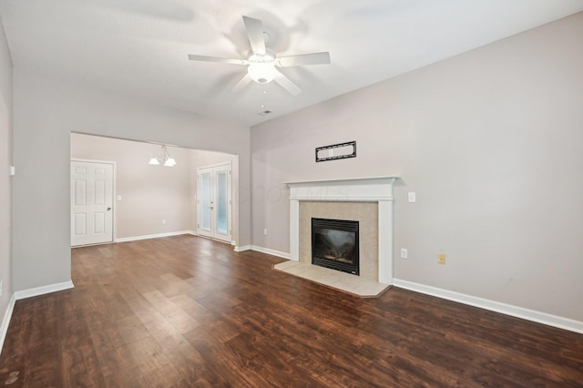 3947 Summerstone Dr, Columbus, OH 43230 - unfurnished living room with wood finished floors, a tile fireplace, ceiling fan, baseboards, and a chandelier